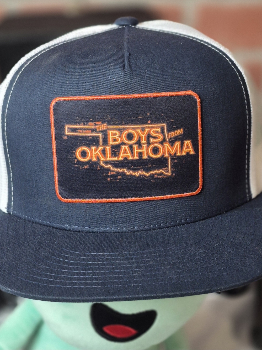 The Boys From Oklahoma Navy & Orange Patch Trucker Hat